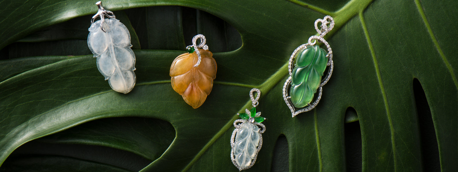 
            
              Four different leaf jade pendants. White jade, yellow jade and green jade.
            
          