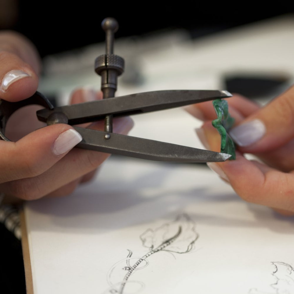 A jewelry craftsman and artisan at work making jade jewelry