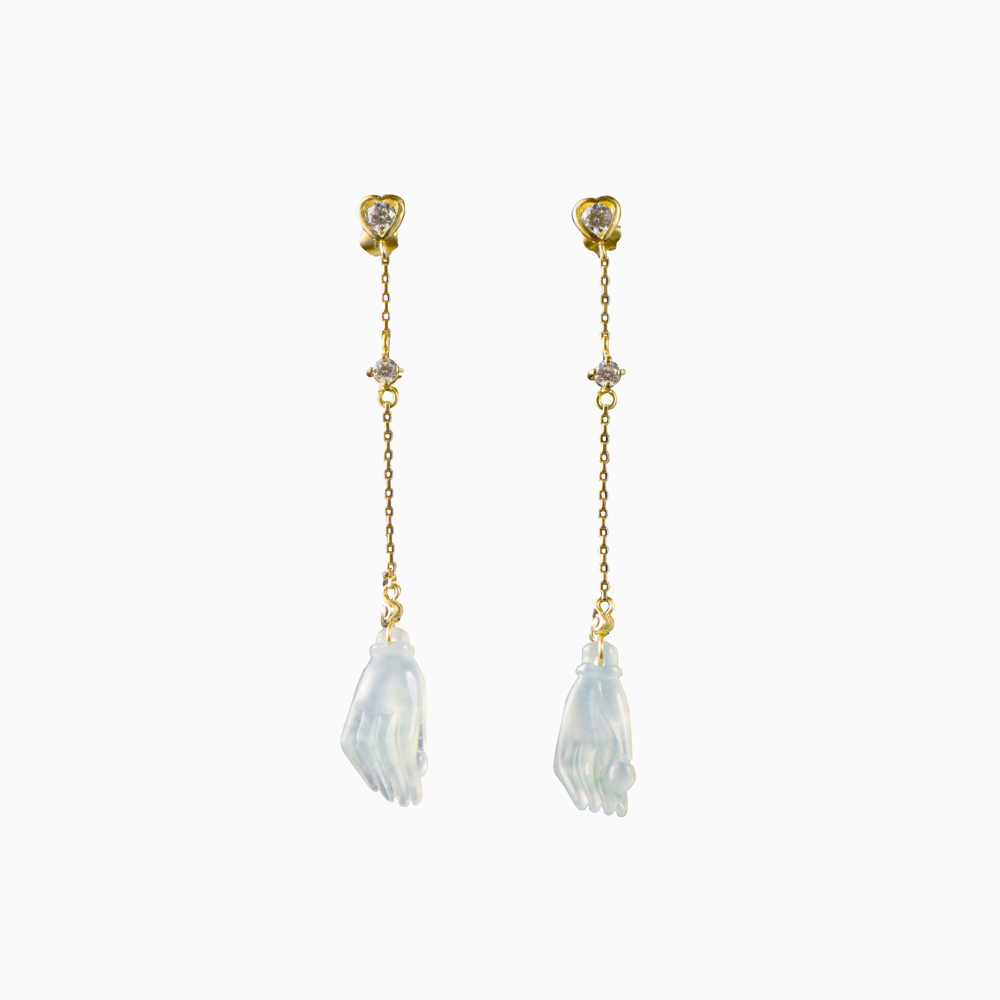 White jadeite Buddha’s hand earrings set on a gold chain with one single stud diamond