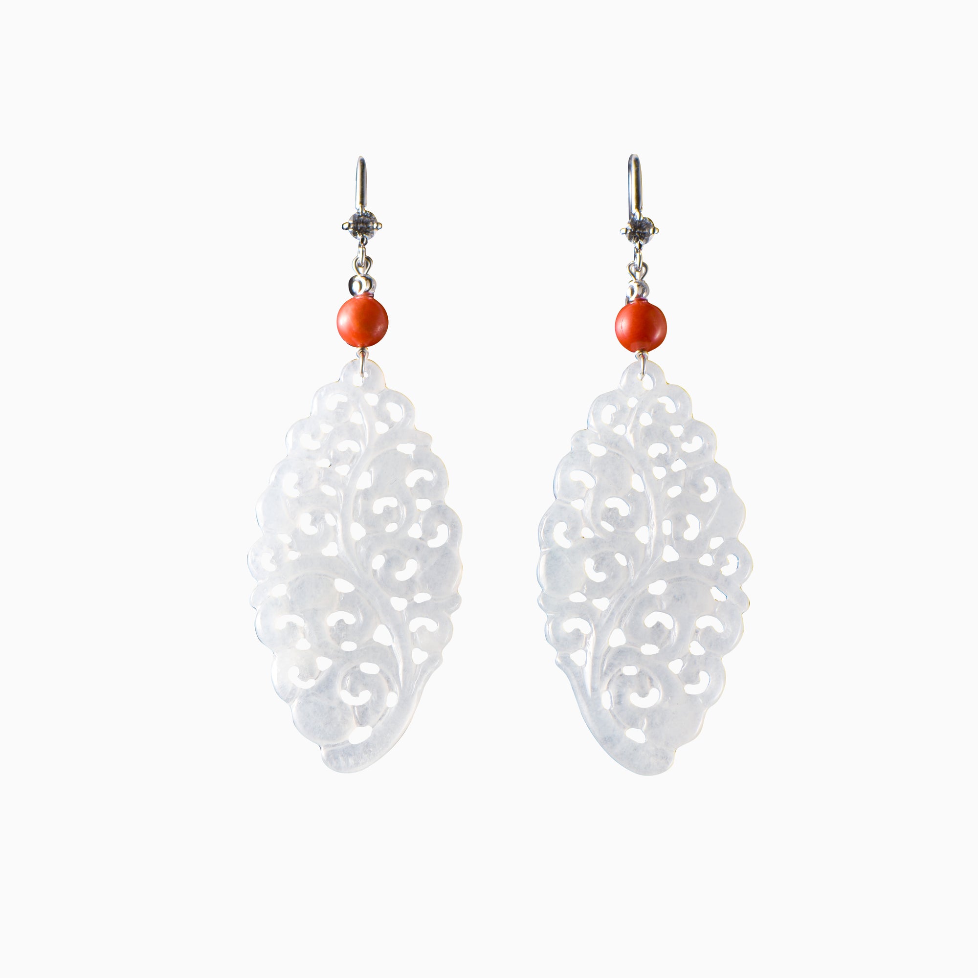White jade earrings in a lotus pattern, decorated with coral and diamonds