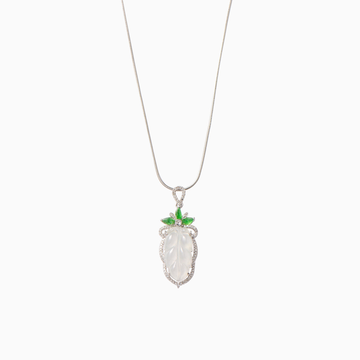 White jade pendant fringed with rich green leaves and diamonds