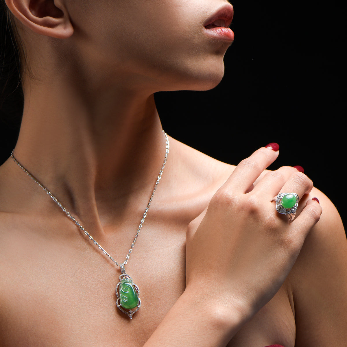 Asian woman wearing an extravagant green jade ring