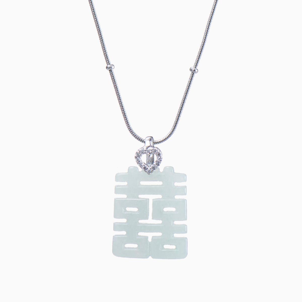 White jade pendant in traditional Chinese design